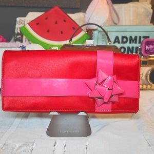 Kate Spade pink and red bow clutch